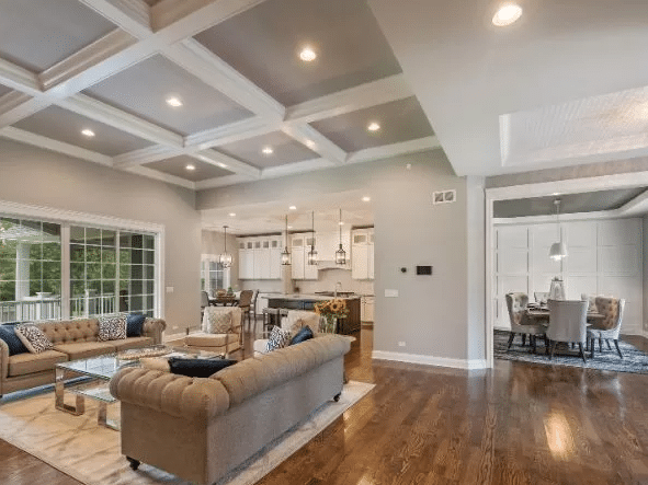 Finished living room with wide hardwood floors