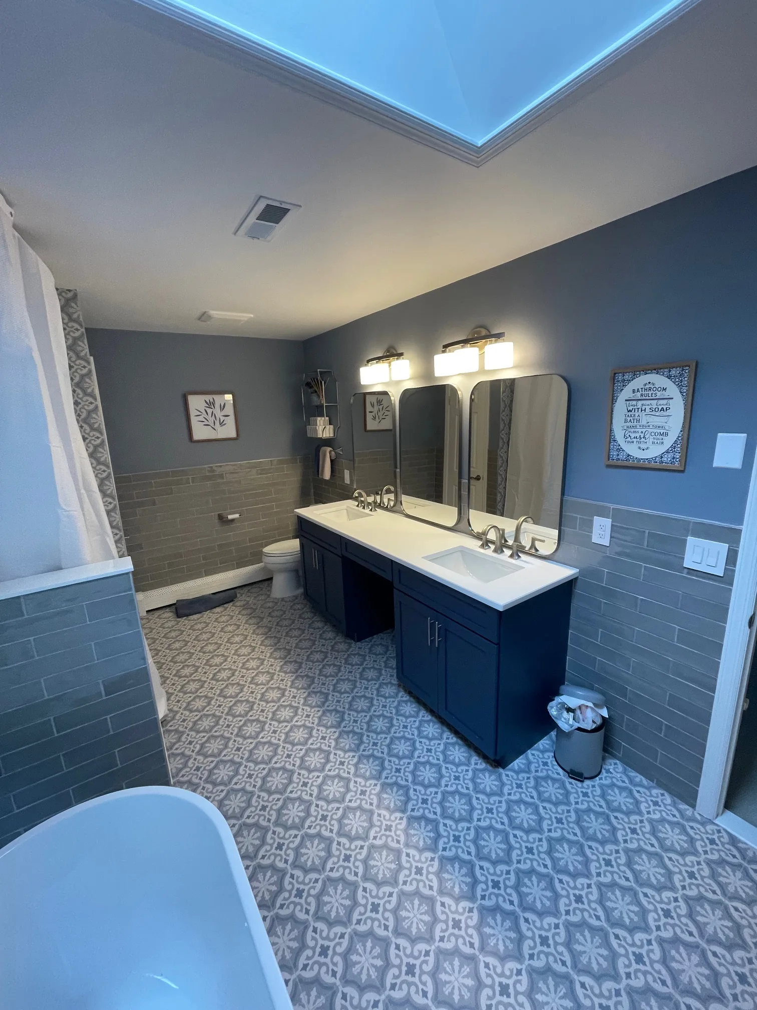 Double vanity bathroom with patterned floor tile